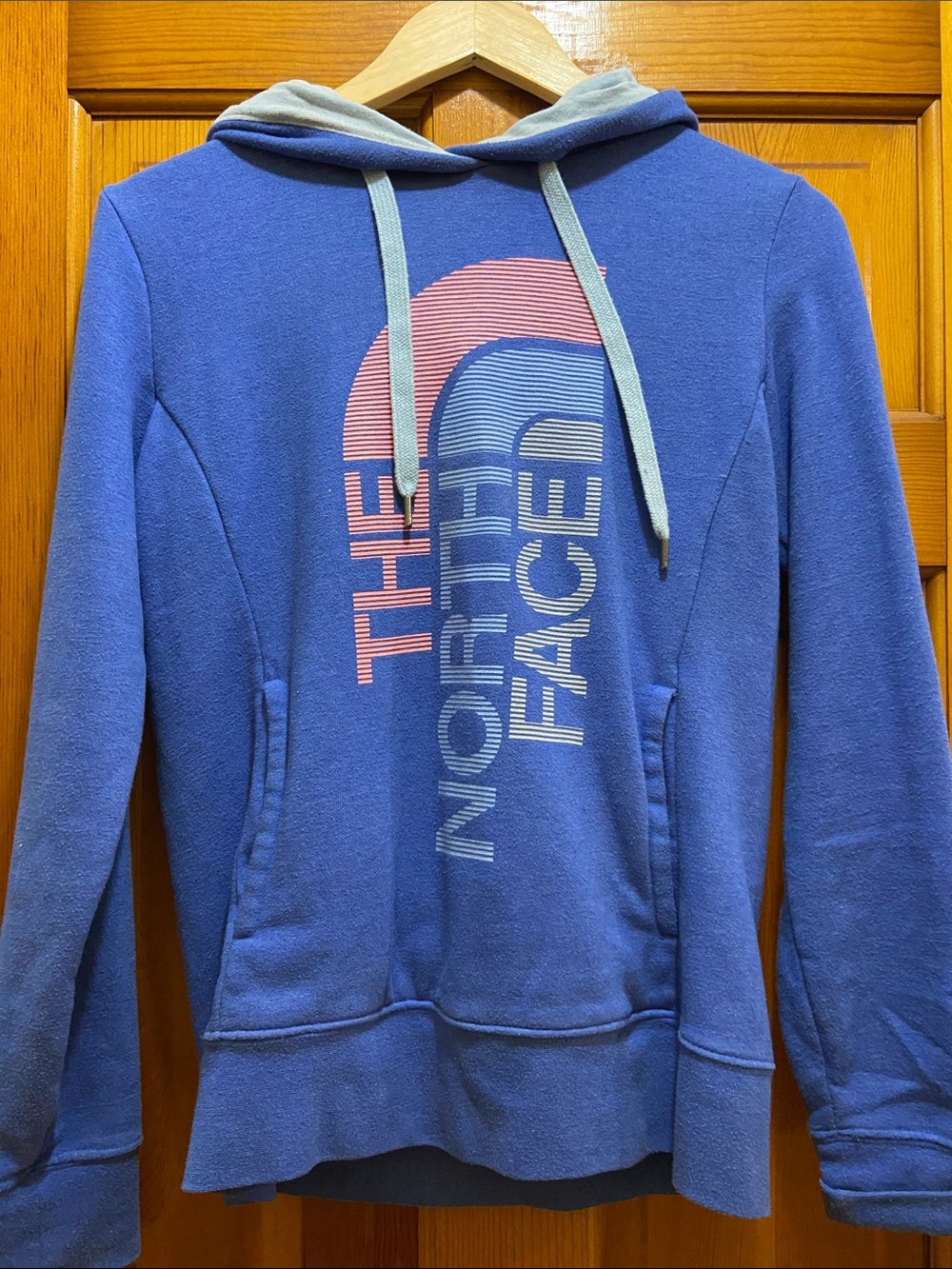 The North Face Blue Hoodie with Pink Graphic